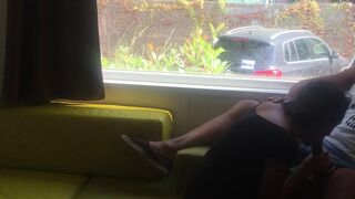 Wife giving risky oral sex in front of window in a camping - 1 image