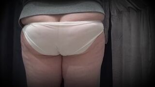 In a fitting room in a public store, the camera caught a plump mother i'd like to fuck with a marvelous gazoo in transparent pants. PAWG. - 3 image